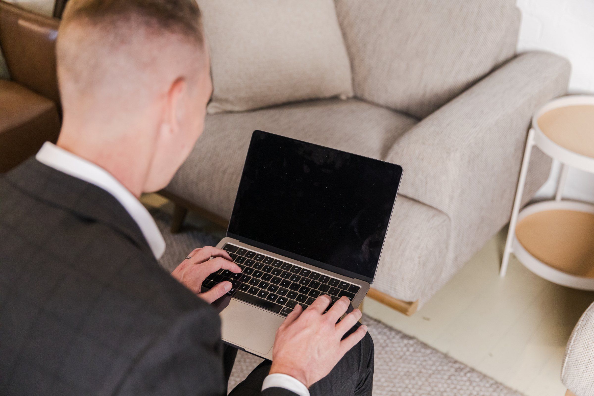Craig Irving working on a laptop