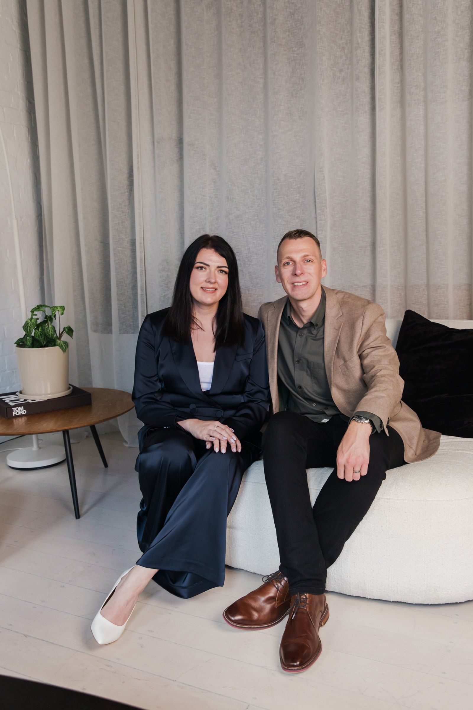 Lynda and Craig Irving seated together in the office