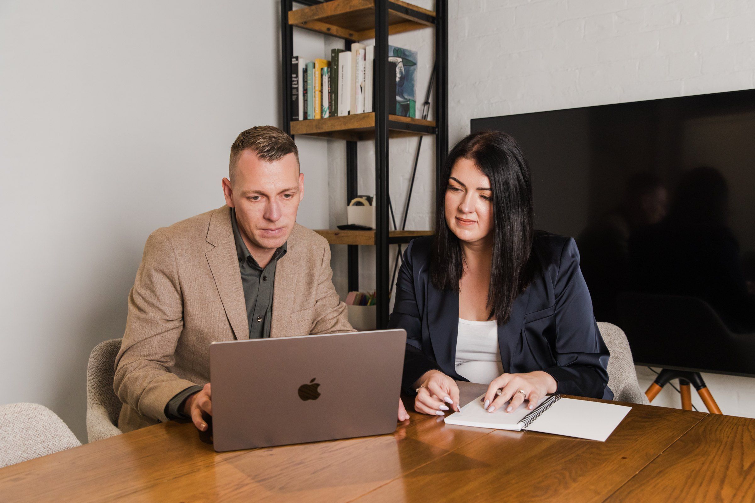 Craig and Lynda Irving reviewing notes together at a table